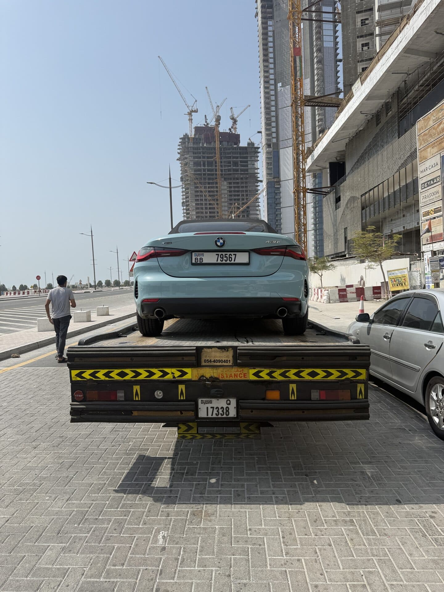 TAS Car Towing recovery truck carrying a BMW 4 Series convertible in Dubai
